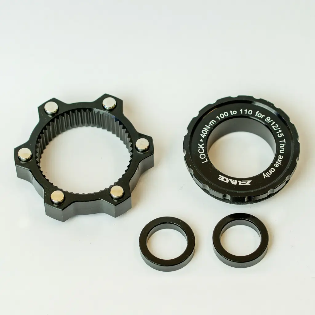 Generic_adapter_front_mtb_boost---(100x15mm-CenterLock-to-110x15mm-6-bolt).webp